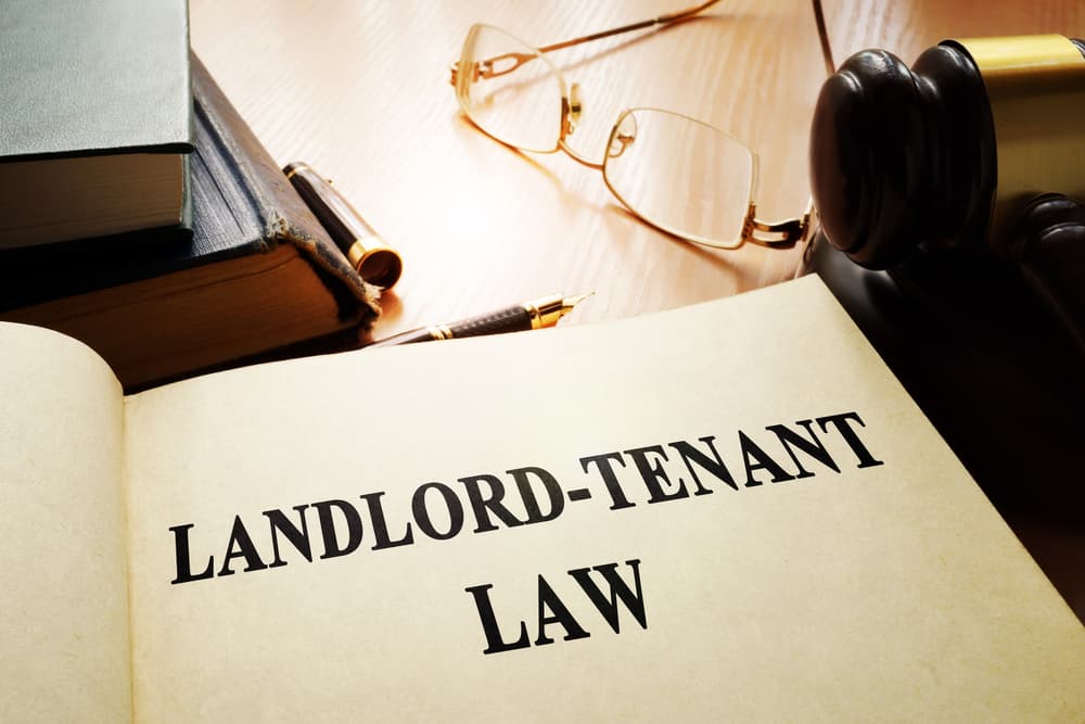 Landlord-tenant law documents on an office table.