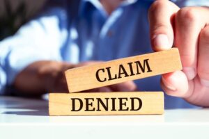 Claim Denied Written on Wooden Blocks