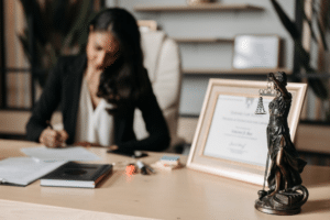 lady justice figurine on wooden table